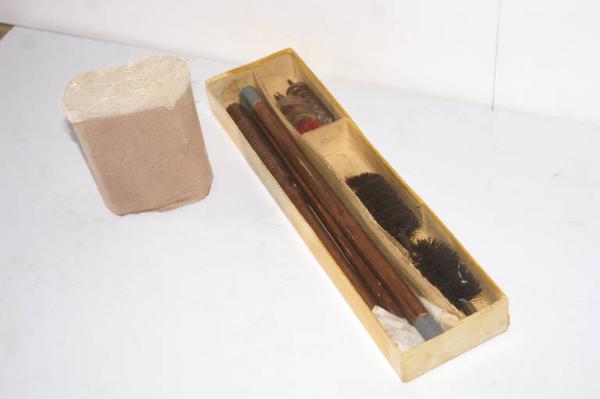 Box with weapon cleaning set for